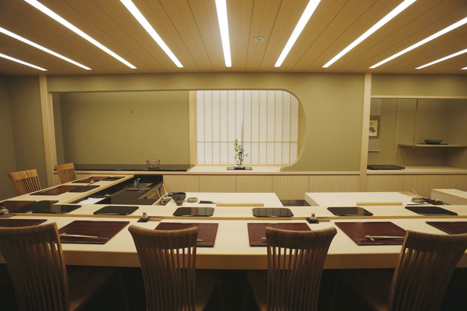 Harutaka sushi counter in Ginza: A pristine setting for traditional Tokyo omakase dining.