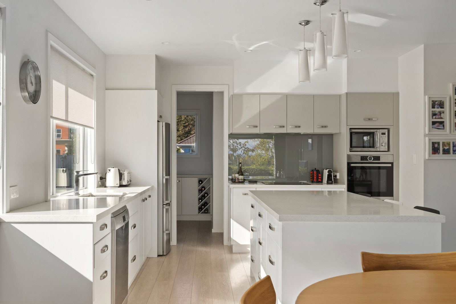 13. Gisborne, New Zealand reveals a subtle wine rack tucked away in a bright, modern space.