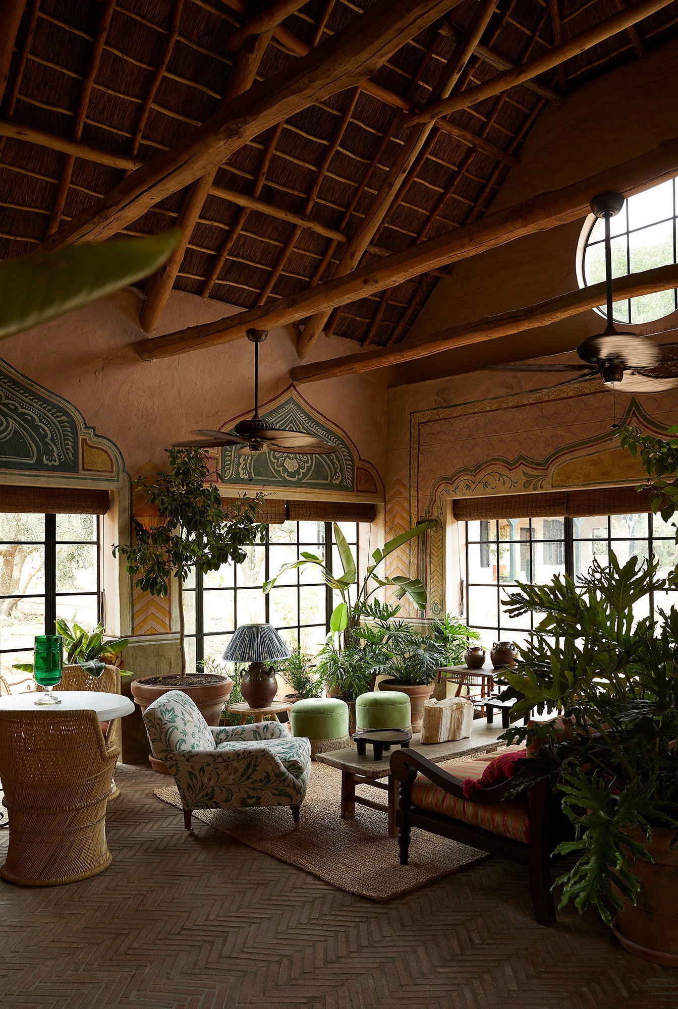 3. Swartland, South Africa features a striking thatched ceiling supported by rough-hewn beams.