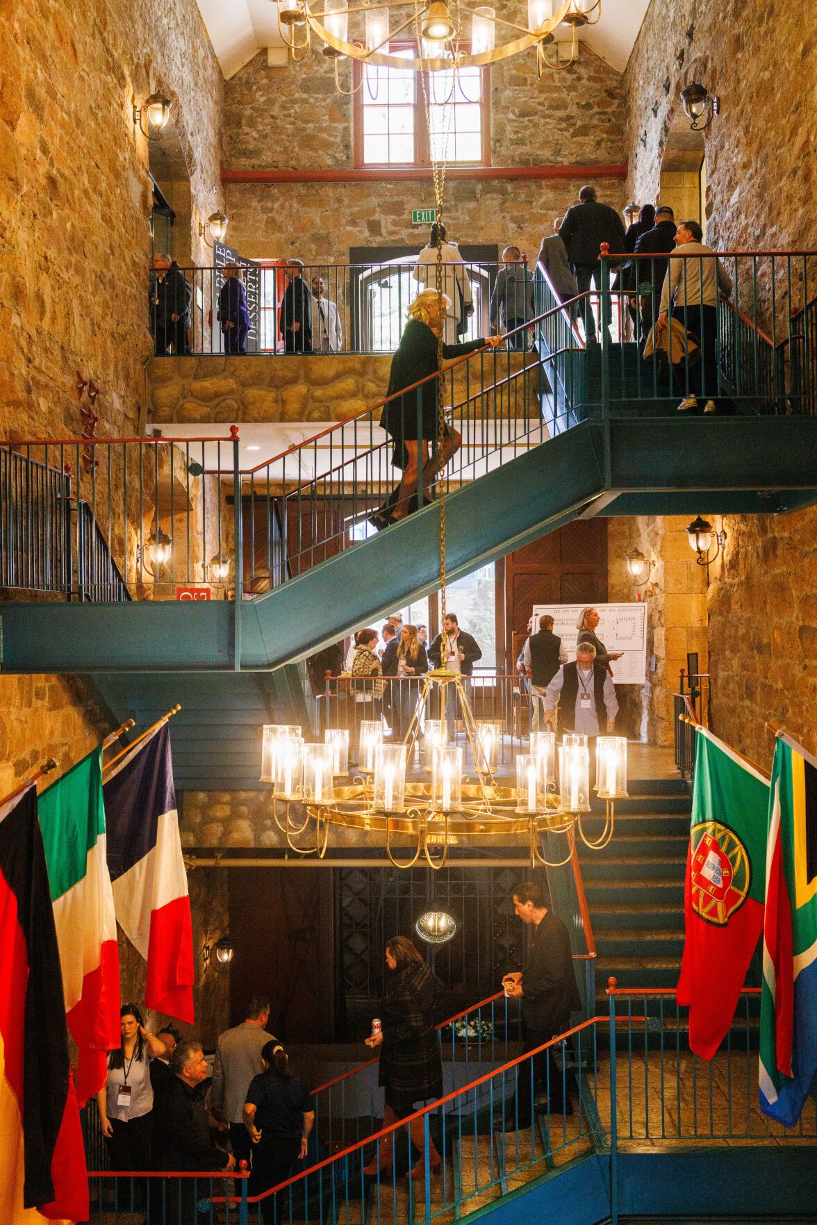 1. Napa Valley Wine Auction (California, USA), with attendees moving across its distinctive teal staircases.