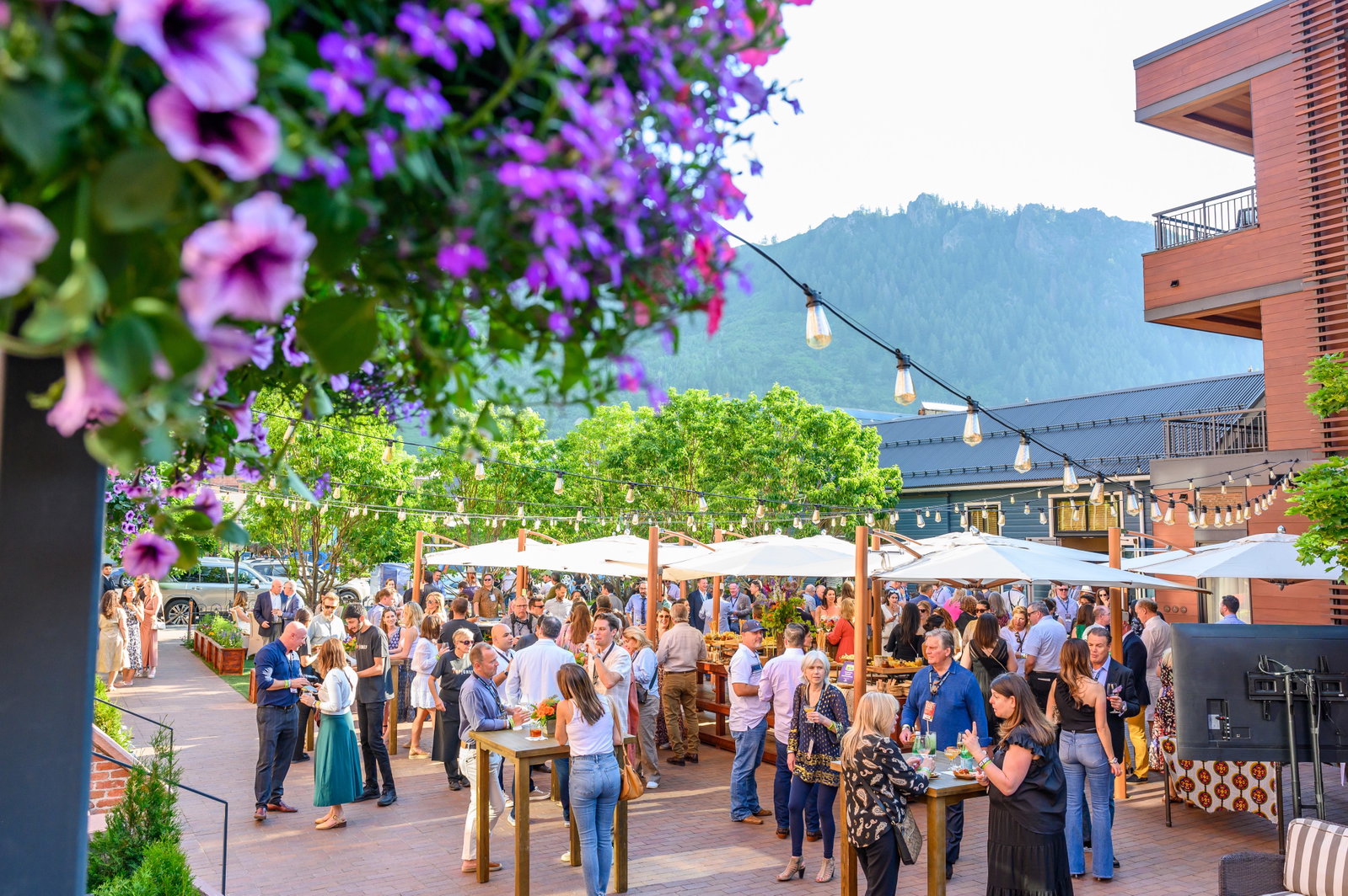 5. Aspen Food & Wine Classic (Colorado, USA) features a bustling outdoor patio filled with attendees.