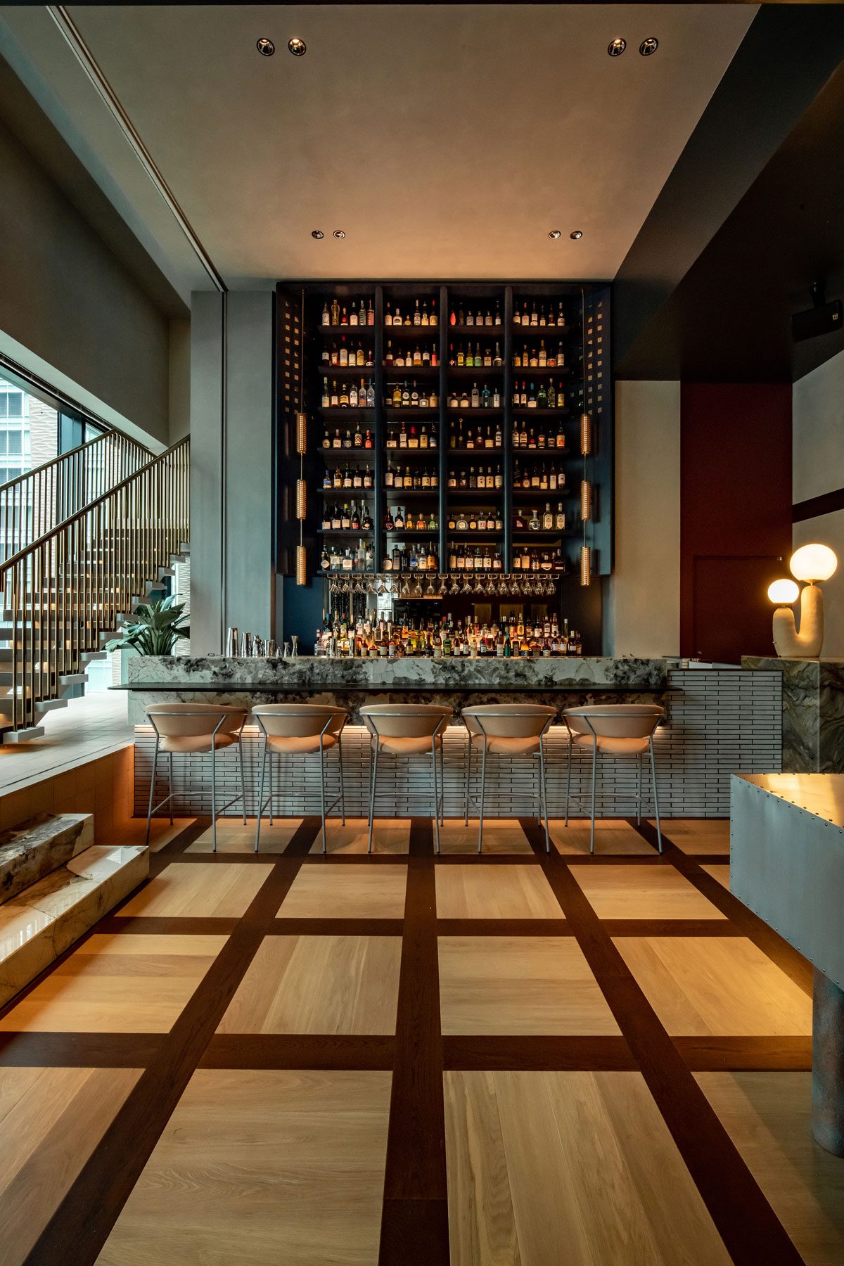The Upper Level's polished wooden floor features a distinctive geometric pattern.