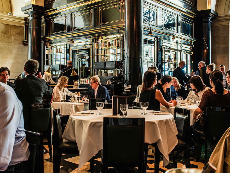 The Wolseley Piccadilly: A busy London business dinner, highlighting calendar competition.