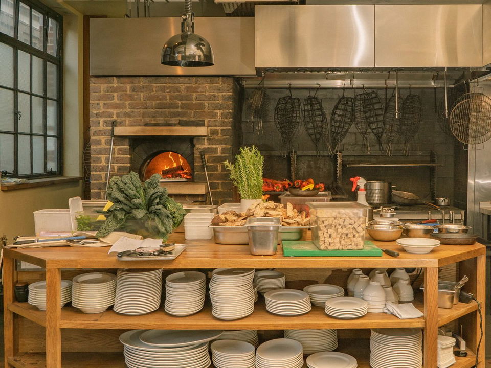 Brat restaurant's open-fire kitchen, a compelling alternative for business dinner London.