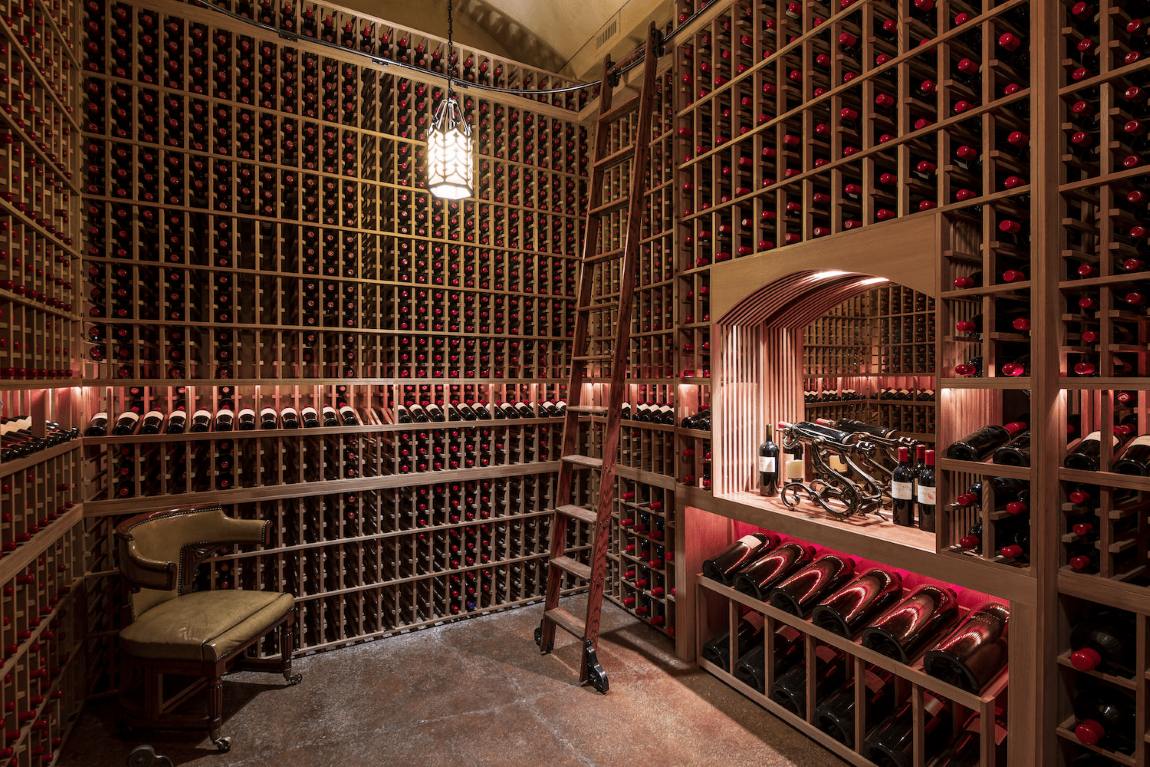 Tychson Hill showcases bottles with warm, inviting red backlighting.