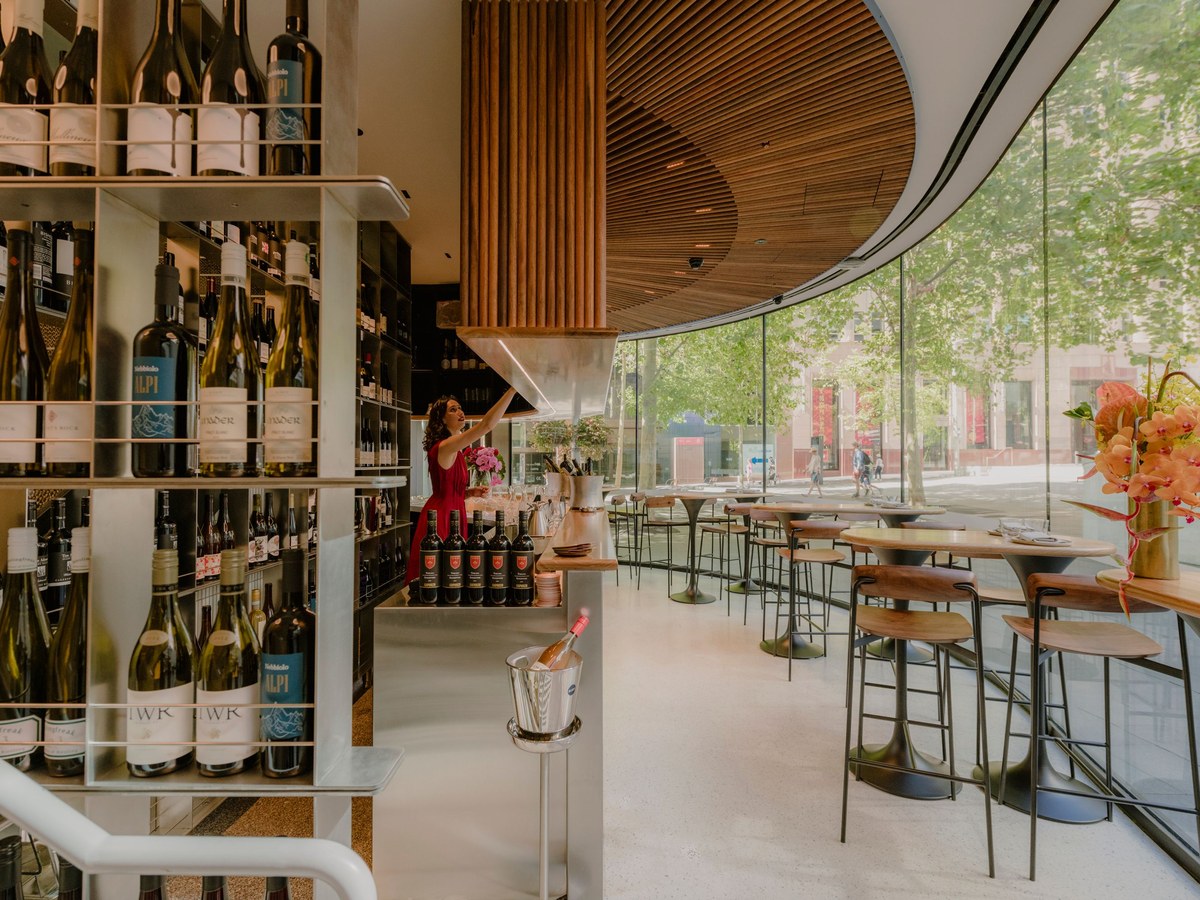 Aalia Wine Room offers a sophisticated setting with extensive wine selections and a view of the city street.