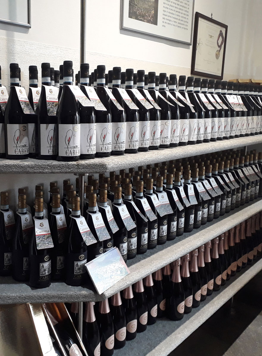Cantina Produttori Nebbiolo di Carema showcases its wines in neat, extensive rows.