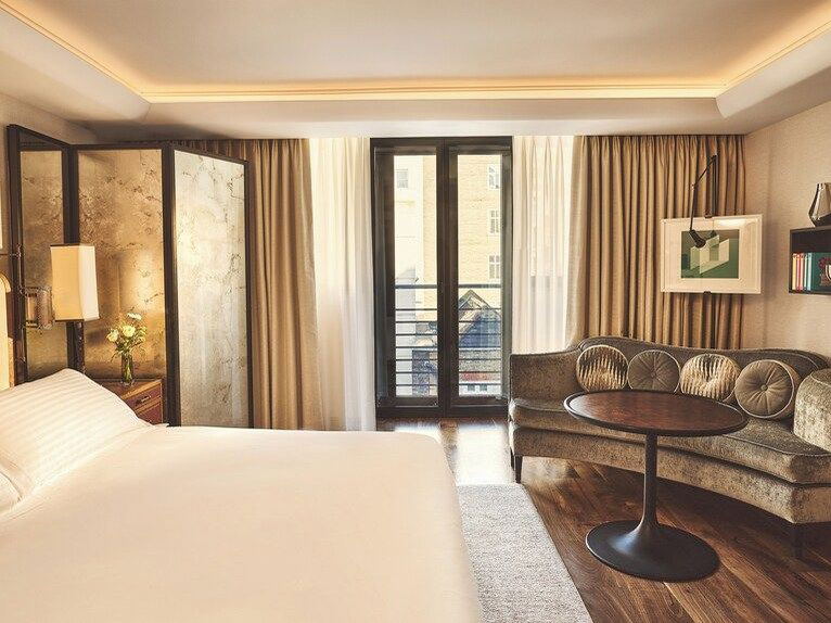 The Connaught hotel guestroom interior highlights the tangible upgrade Amex Fine Hotels + Resorts London delivers.