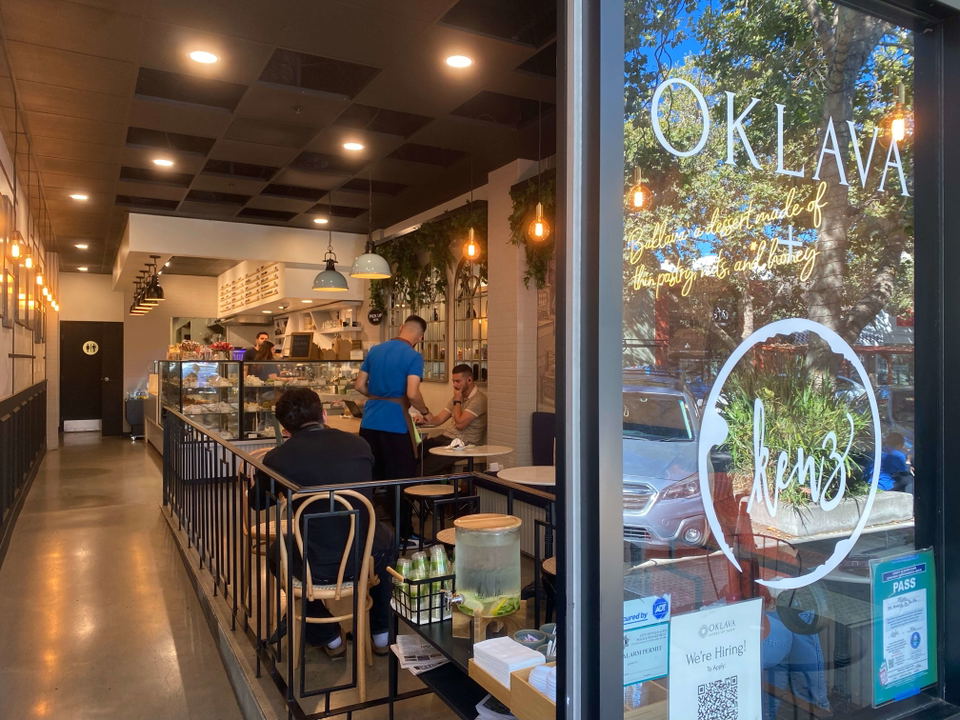 Oklava Cafe (Mid-Market) features a glass display case showcasing an array of tempting pastries.