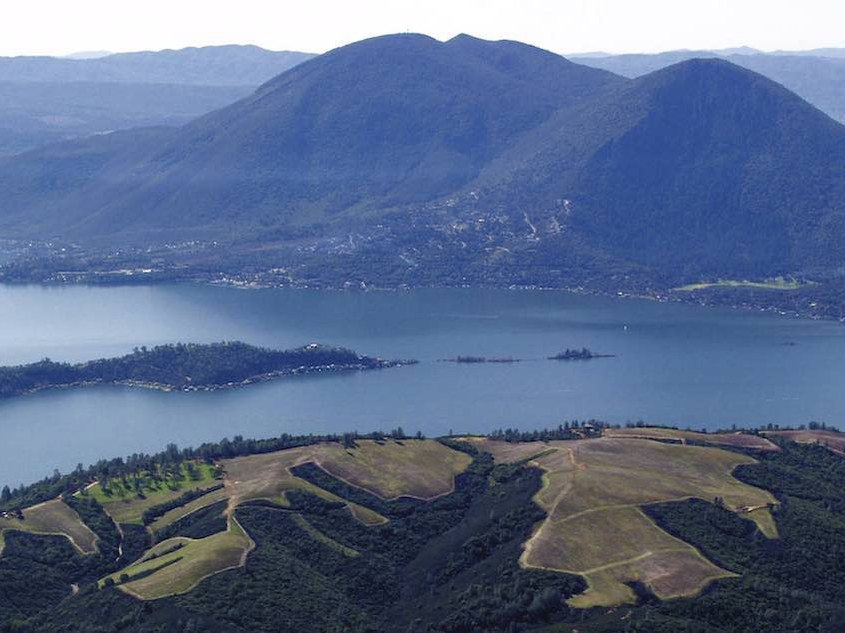 Clear Lake with Mount Konocti and vineyard rows captures Lake County's defining volcanic landscape.