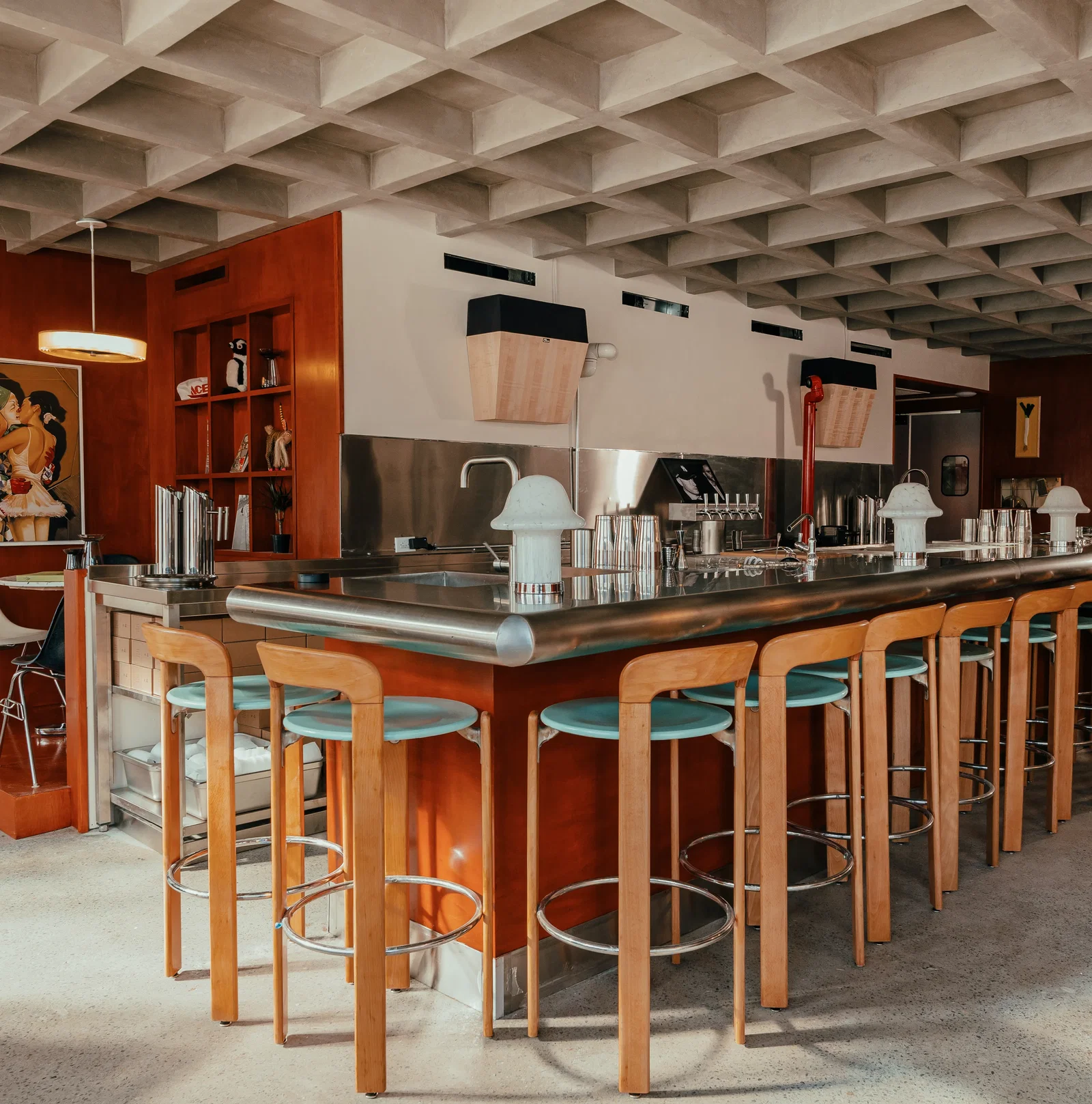 4. Two Schmucks features a striking waffle-patterned concrete ceiling.