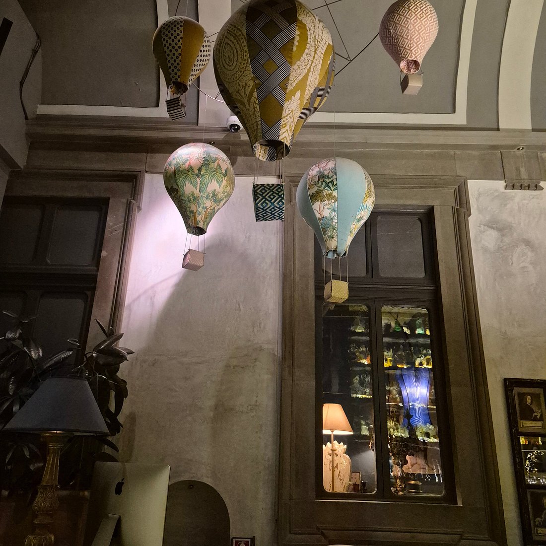 1. Locale Firenze features whimsical hot air balloon decorations hanging from its high ceiling.