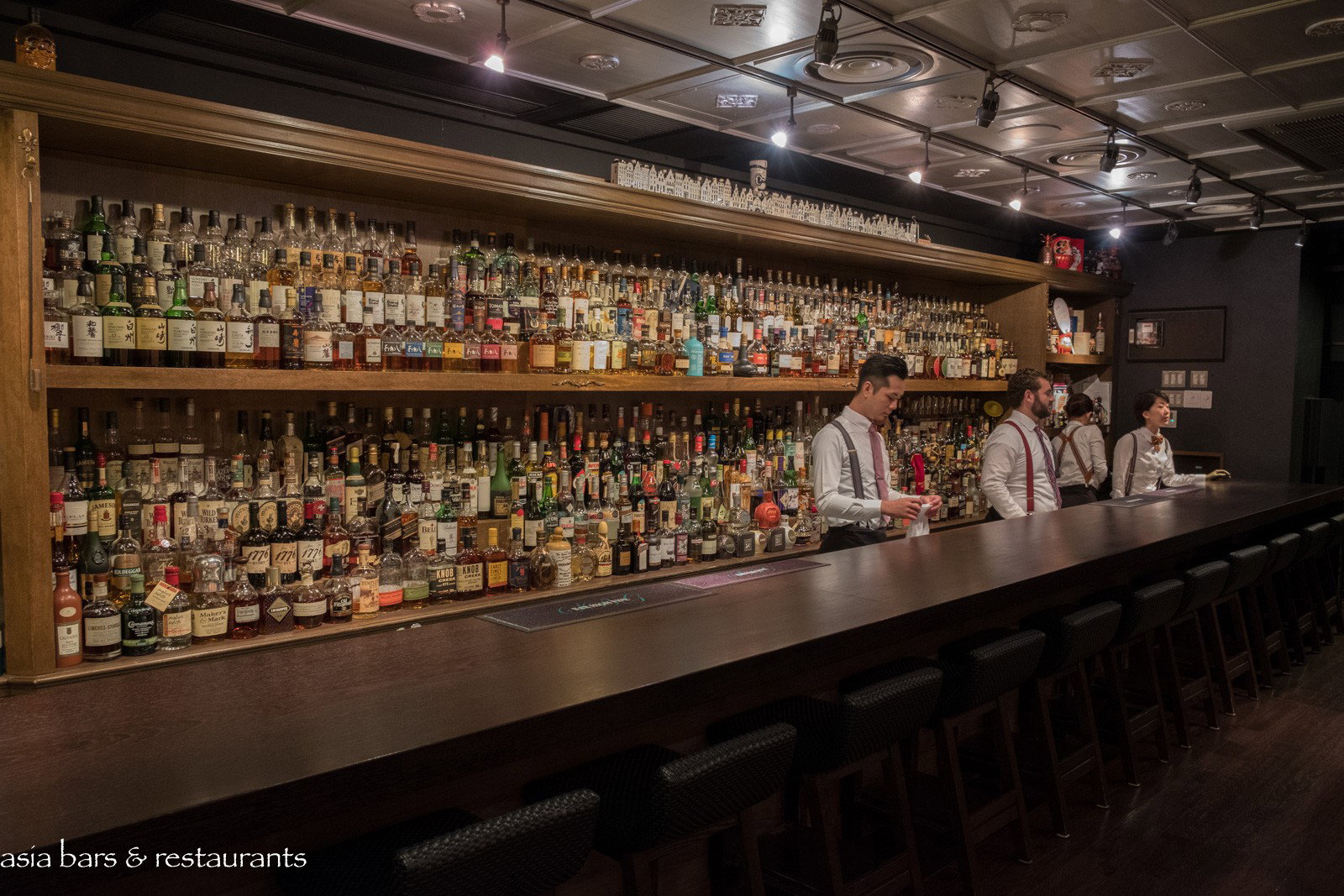 2. Bar High Five (Ginza) features an impressive, multi-tiered wall of spirits behind the bar.