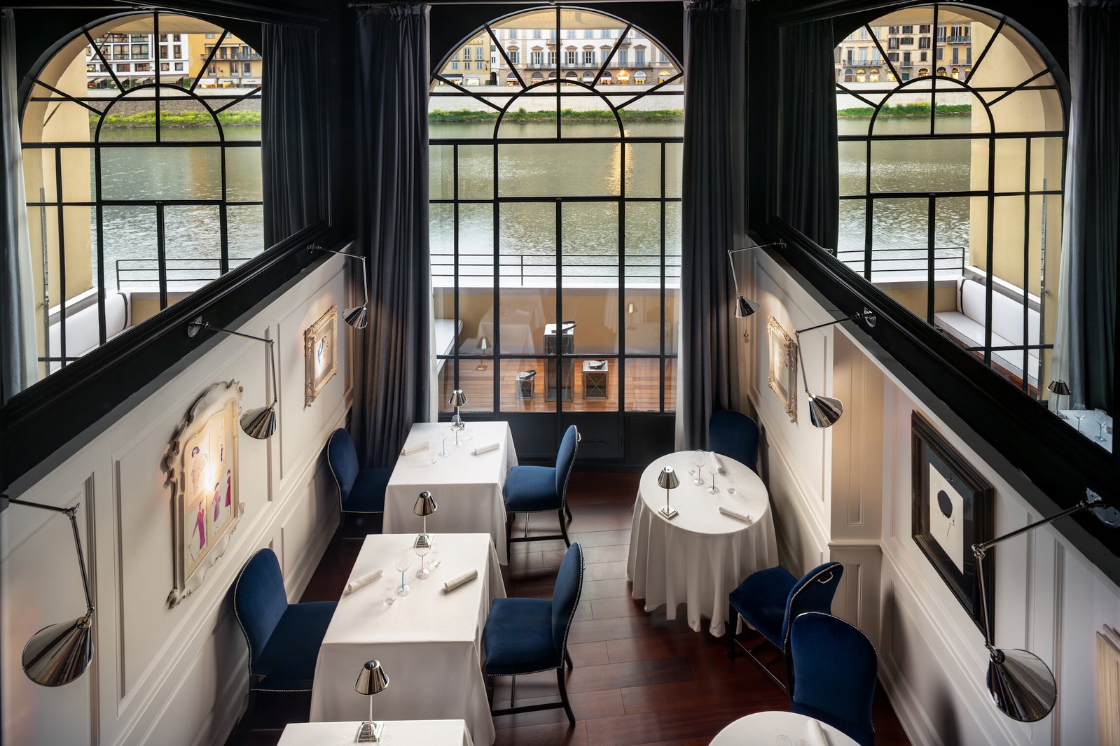 4. Borgo San Jacopo features elegant arched windows overlooking the water.