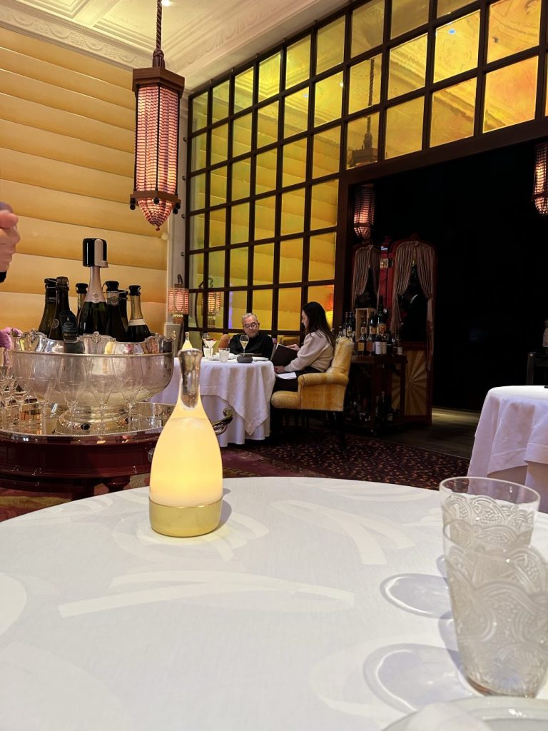 4. Sketch, The Lecture Room & Library features a striking amber-toned window illuminating the elegant space.