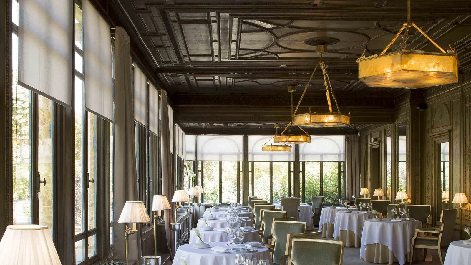 9. Alléno Paris au Pavillon Ledoyen features a grand, dark ornate ceiling.