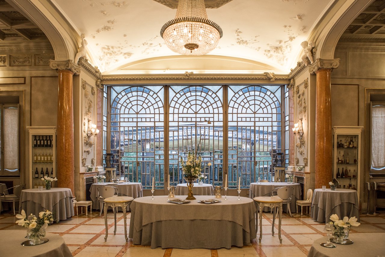 6. Enoteca La Torre's grand dining room is illuminated by impressive arched windows.