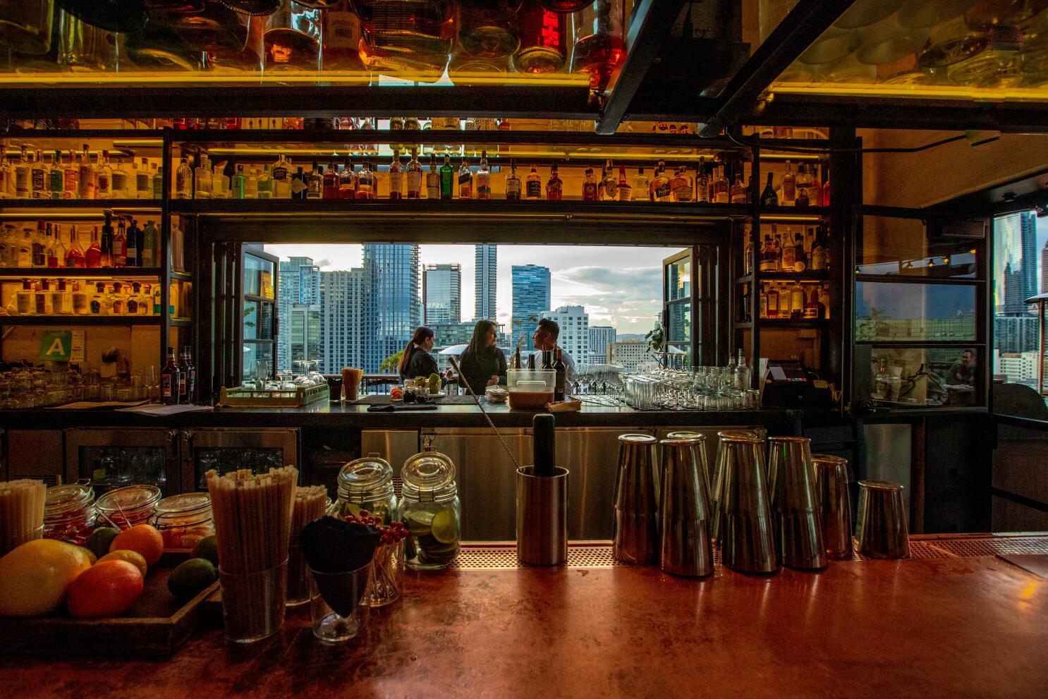 Rooftop Bars and Views features a distinctive copper-toned bar counter.