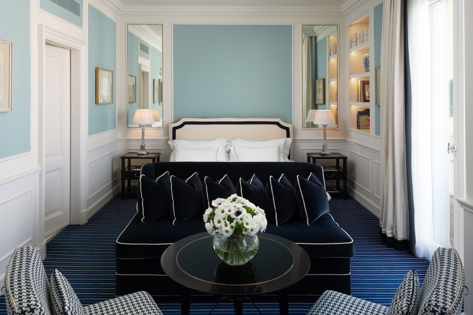 5. Hotel Lungarno presents a harmonious blend of serene light blue and deep navy tones.