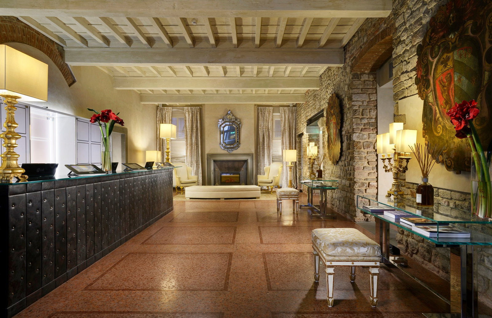7. Hotel Brunelleschi showcases original exposed stone walls and wooden beams, creating a historic ambiance.