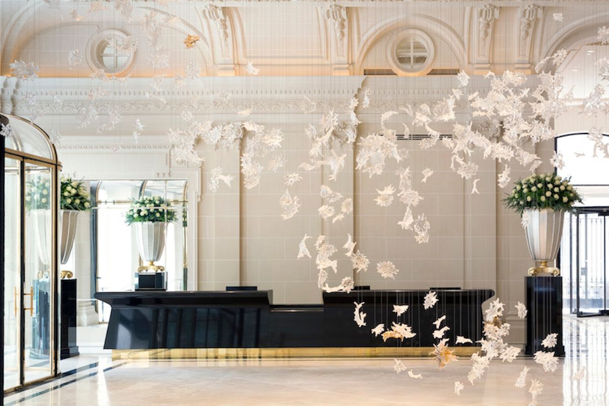 10. The Peninsula Paris's lobby is adorned with a captivating, delicate white suspended art installation.