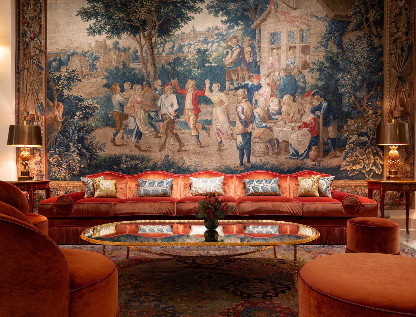 3. Le Bristol Paris showcases a grand tapestry depicting a lively pastoral scene.