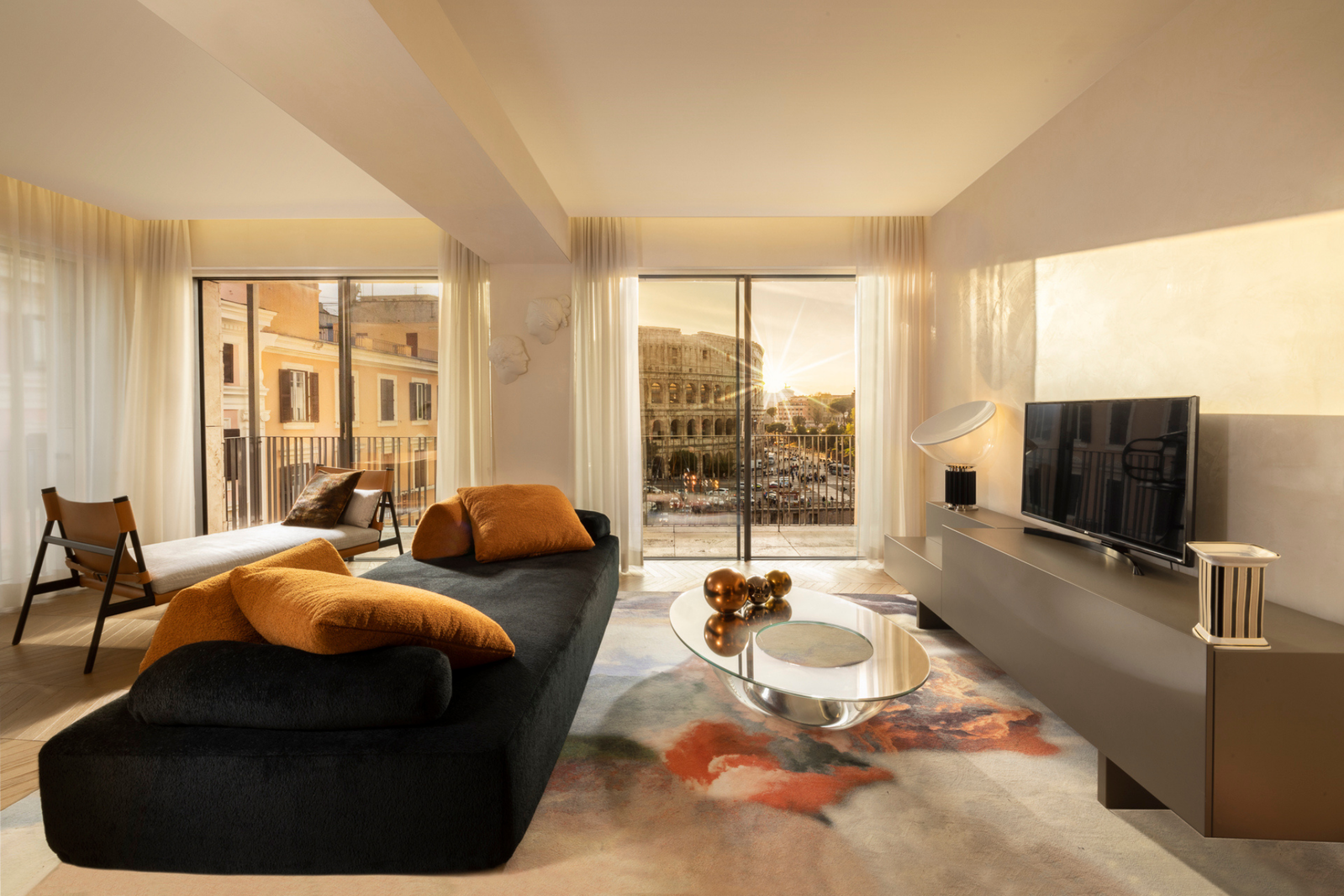 7. Palazzo Manfredi (Small Luxury Hotels) features a spacious living area with a striking abstract rug.