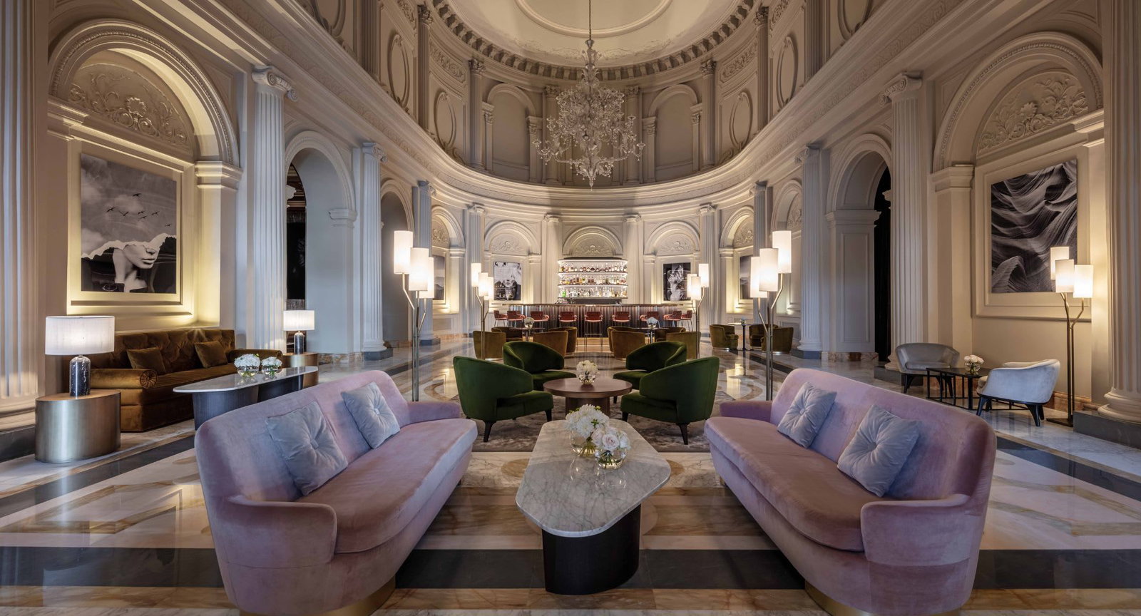 8. Anantara Palazzo Naiadi presents a sophisticated lounge with plush pink and green seating.