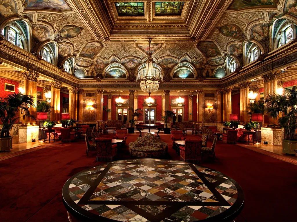 9. Grand Hotel Plaza showcases a striking round marble table with a geometric pattern.