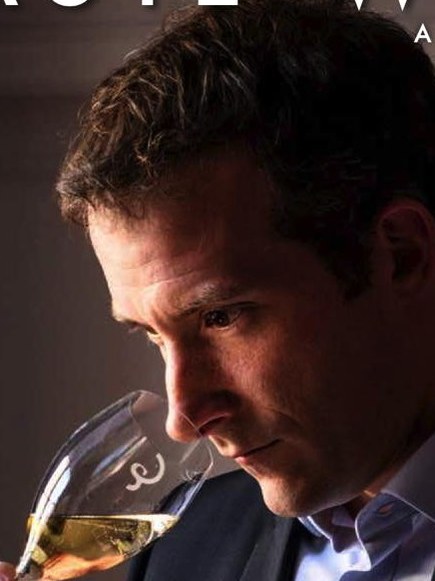 Mathieu Roland-Billecart evaluates a sparkling wine.