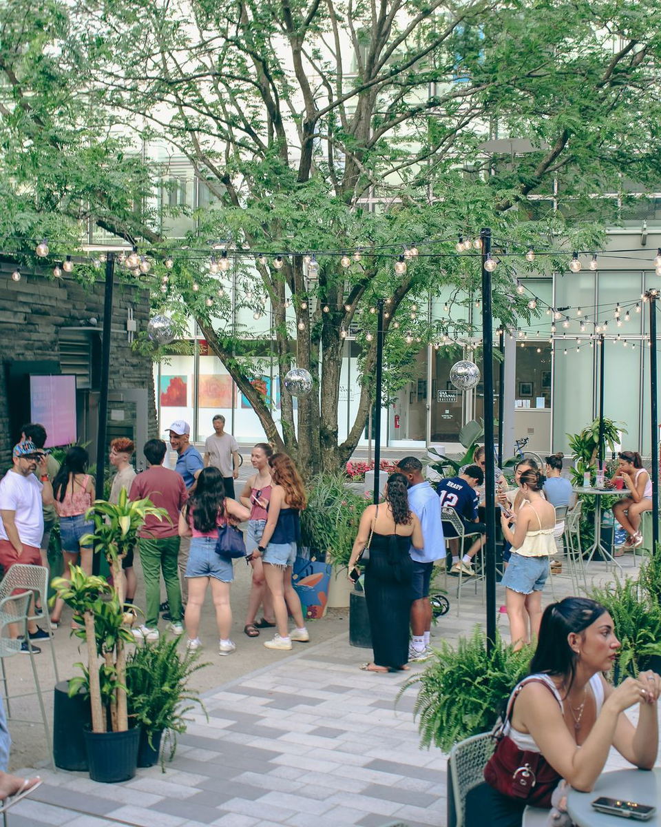 Saguaro Garden Bar by the Fat Cactus (Kendall Square) features charming string lights illuminating the lively outdoor space.