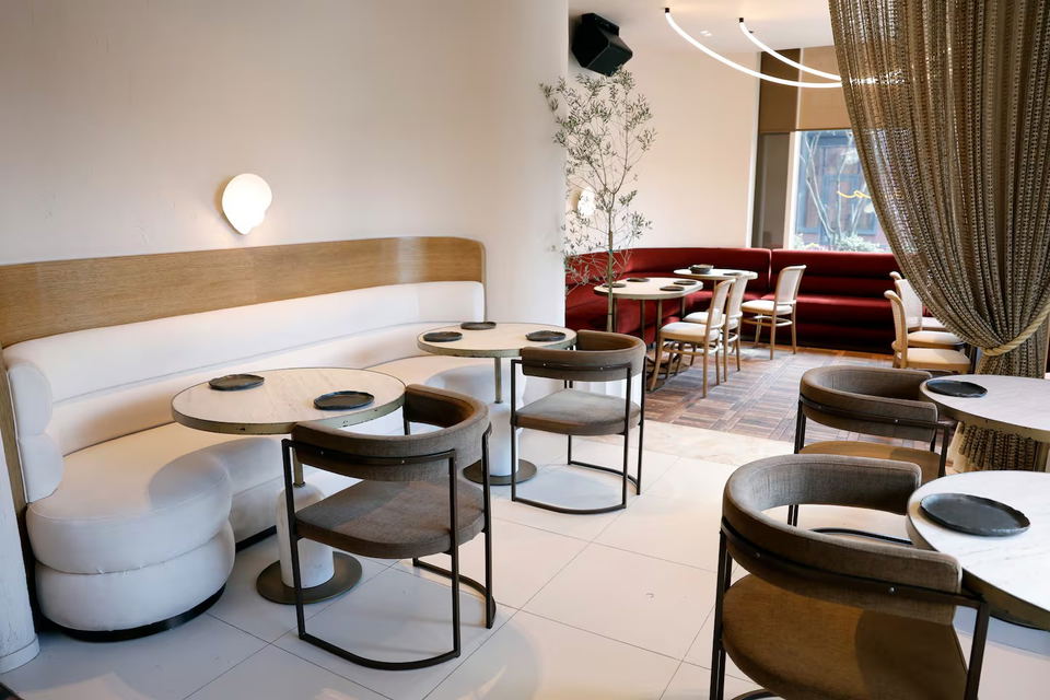 Scull and Keel Fish House and Spirits (East Cambridge) features elegant white curved banquettes.