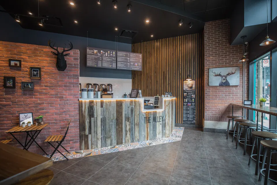 The Alley (Downtown) greets visitors with its eye-catching counter made of varied wooden planks.