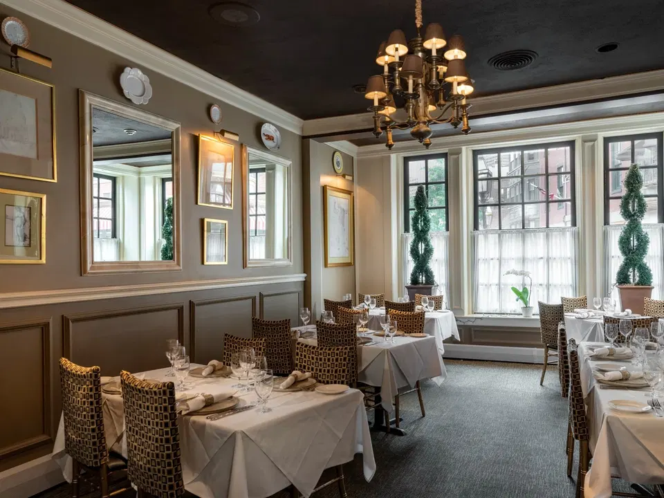 A welcoming bar atmosphere celebrating zero-proof cocktails and Mediterranean cuisine in Jamaica Plain.