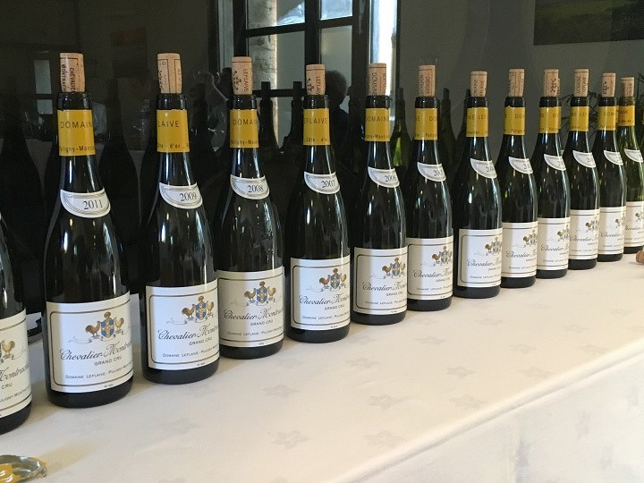 Chevalier-Montrachet, Grand Cru, bottles from various vintages, a testament to Burgundy's enduring legacy.