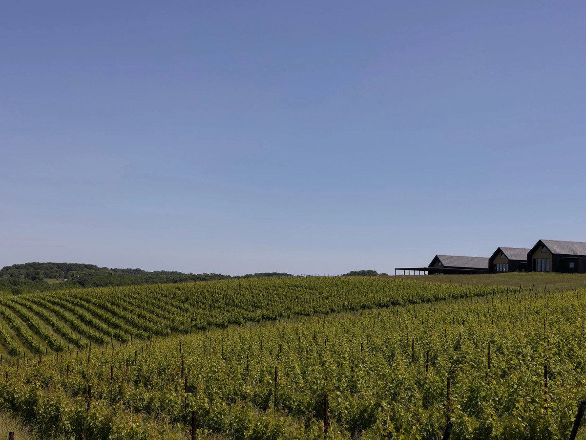 An exterior or arrival view of Burnt Hill Farm's winery building set within the 117-acre Montgomery County Maryland property, the destination drive fr
