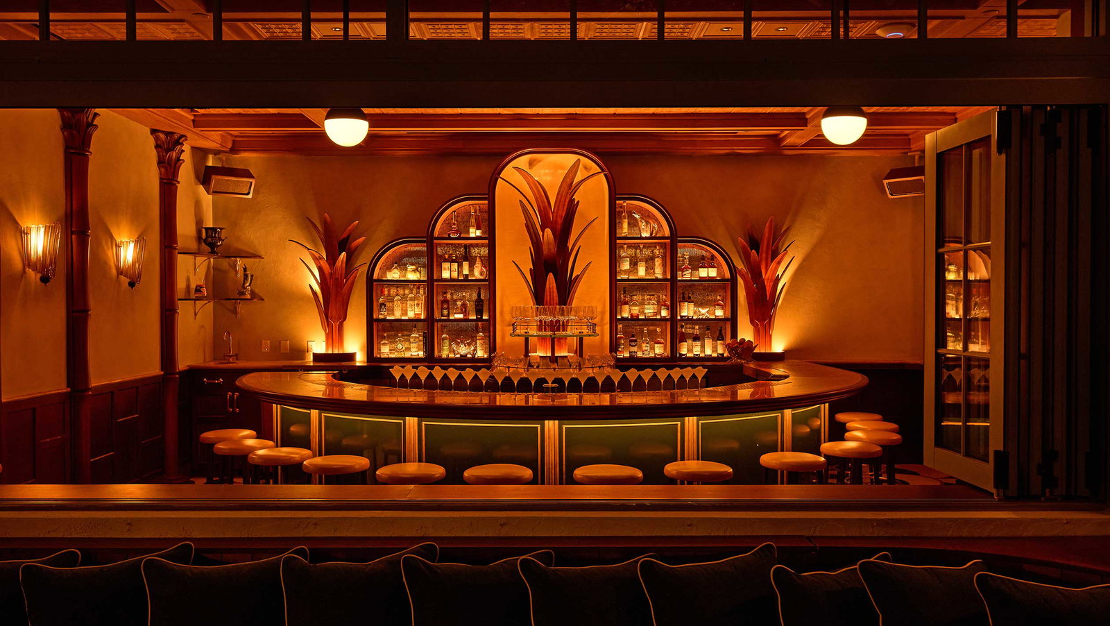 Wine Program is illuminated by a warm, golden glow that highlights the rich wood and glass.