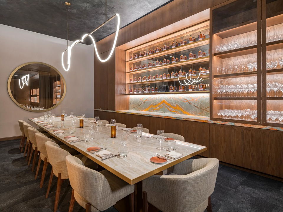 The Whiskey Room at Carversteak Las Vegas offers an intimate private dining experience with a stunning whiskey display.