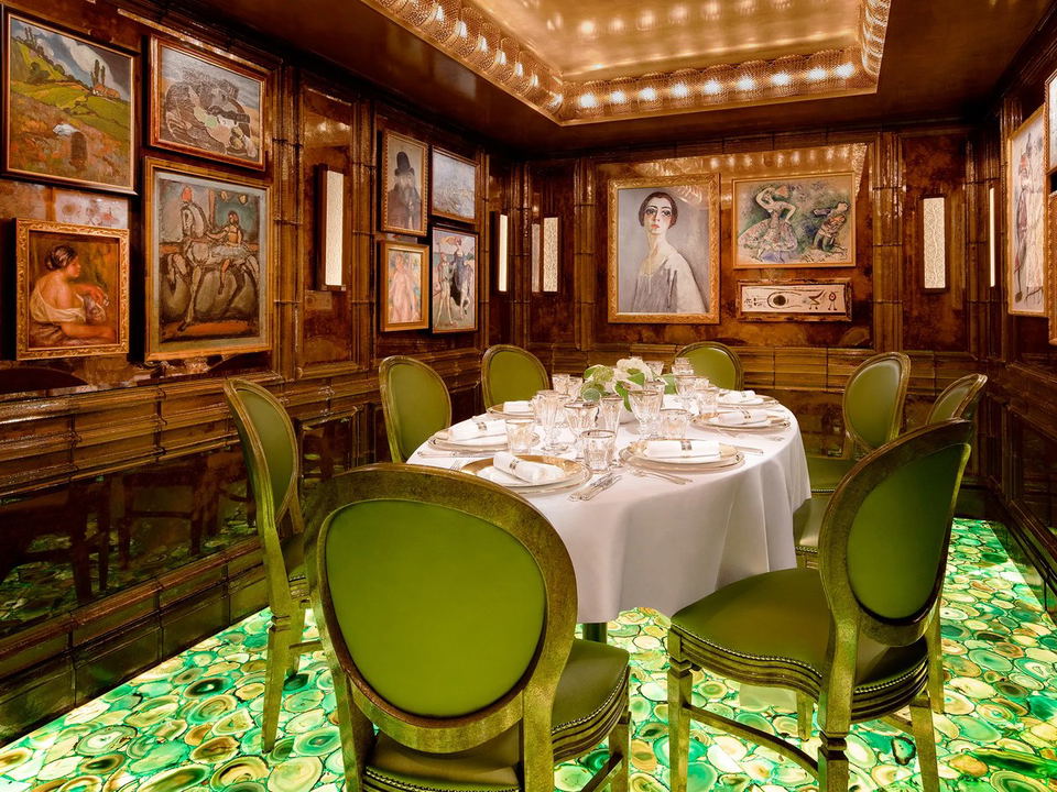 A Platinum Arowana Room: An opulent private dining room with an agate-lit floor and art-filled walls.