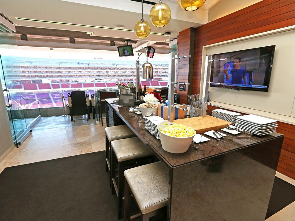 A Stadium suites offer a luxurious game-day experience with catered food, drinks, and a view of the stadium.