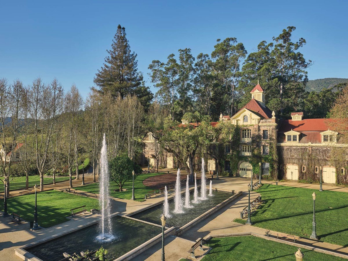 Inglenook Winery's historic estate showcases its grand château, formal fountain courtyard, and manicured lawns.