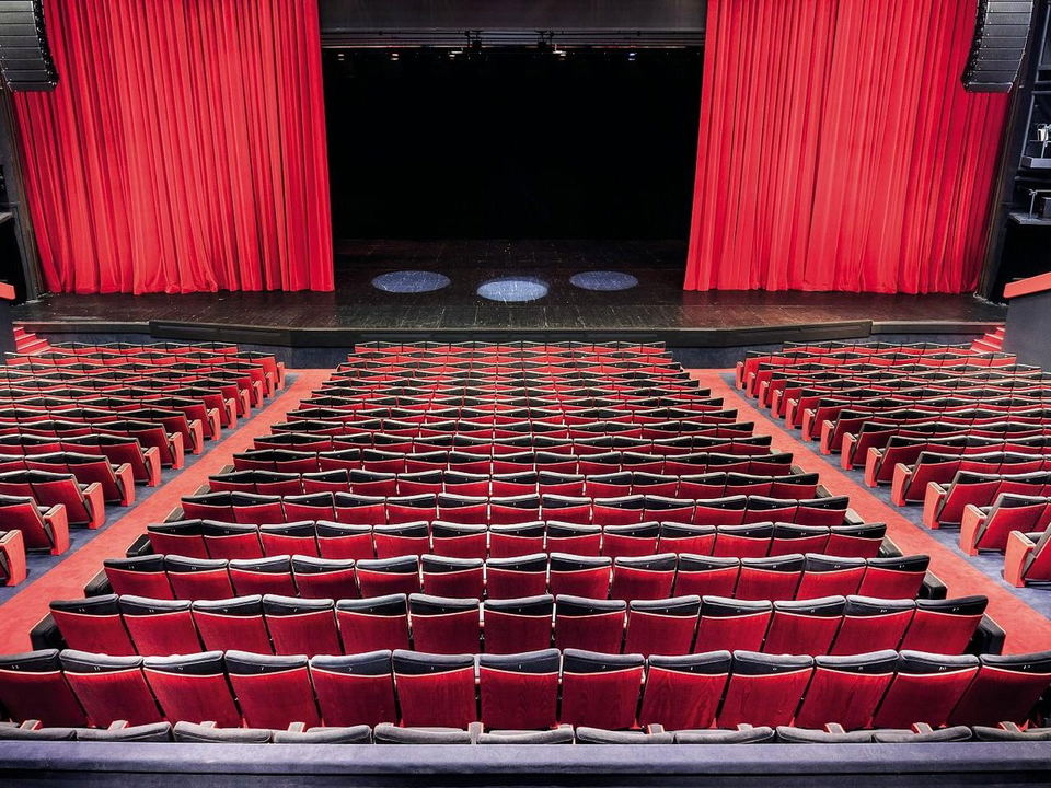 The Grand Théâtre Lumière awaits the Cannes Film Festival audience, its red seats ready for cinematic magic.