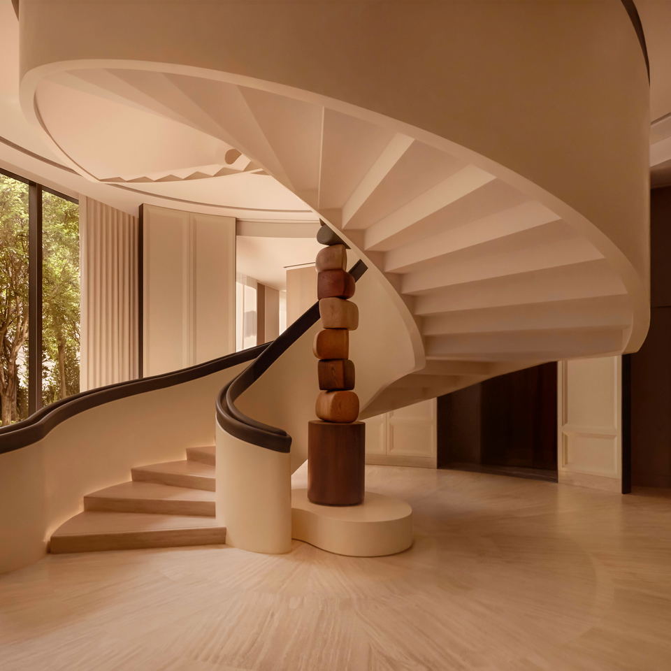 Capella Taipei: A sculptural spiral staircase with flowing curved lines and a modern stacked sculpture.