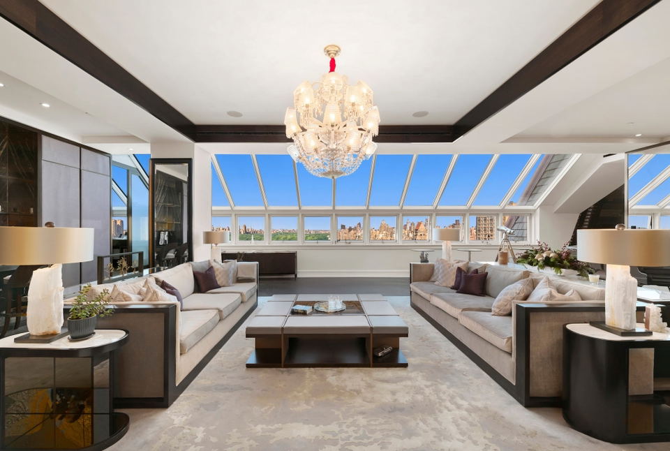 What’s Next for Central Park hotels, featuring a grand, multi-tiered crystal chandelier.