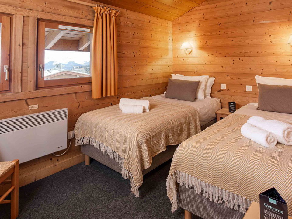 Chalet Pierre Méribel offers cozy twin-bedded rooms with mountain views, ideal for a December 2026 stay.