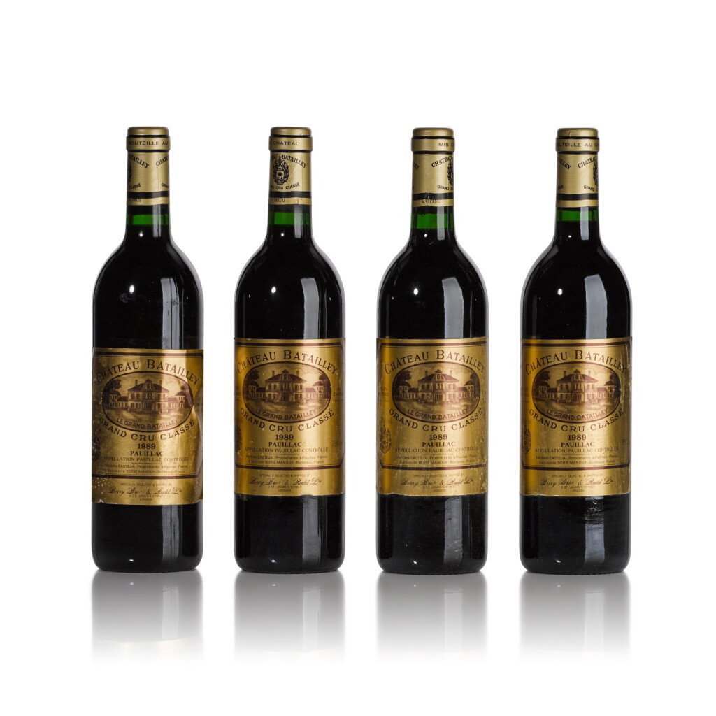 Four bottles of Château Batailley 1989 Grand Cru Classé Pauillac red wine with gold labels, selected by Berry Bros and Rudd.