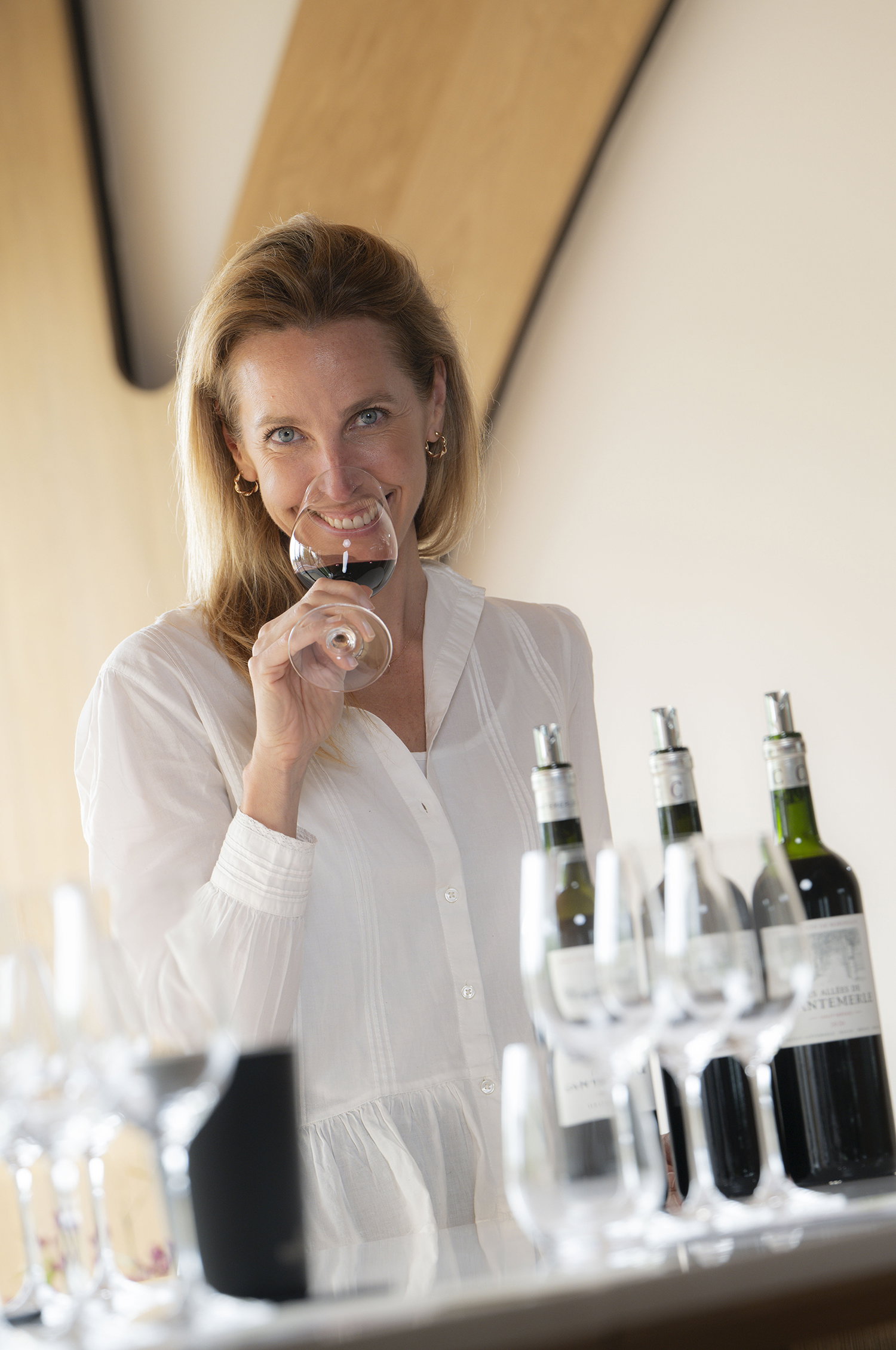 Laure Canu, General Manager of Château Cantemerle, in a professional outdoor portrait.