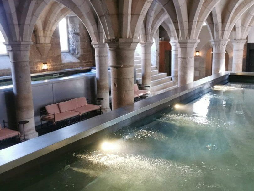 Château de Cîteaux's 12th-century cellars house one of two indoor swimming pools.