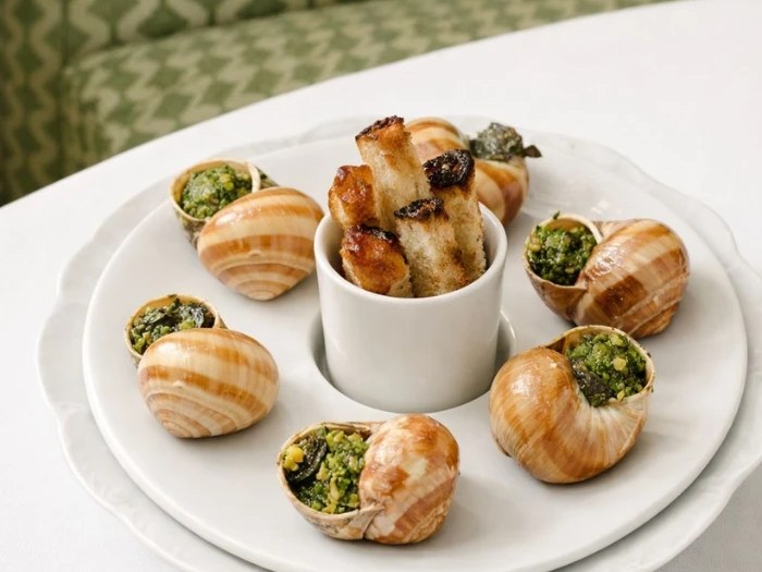 Château de Cîteaux's Célestine restaurant presents escargots with roasted poultry.