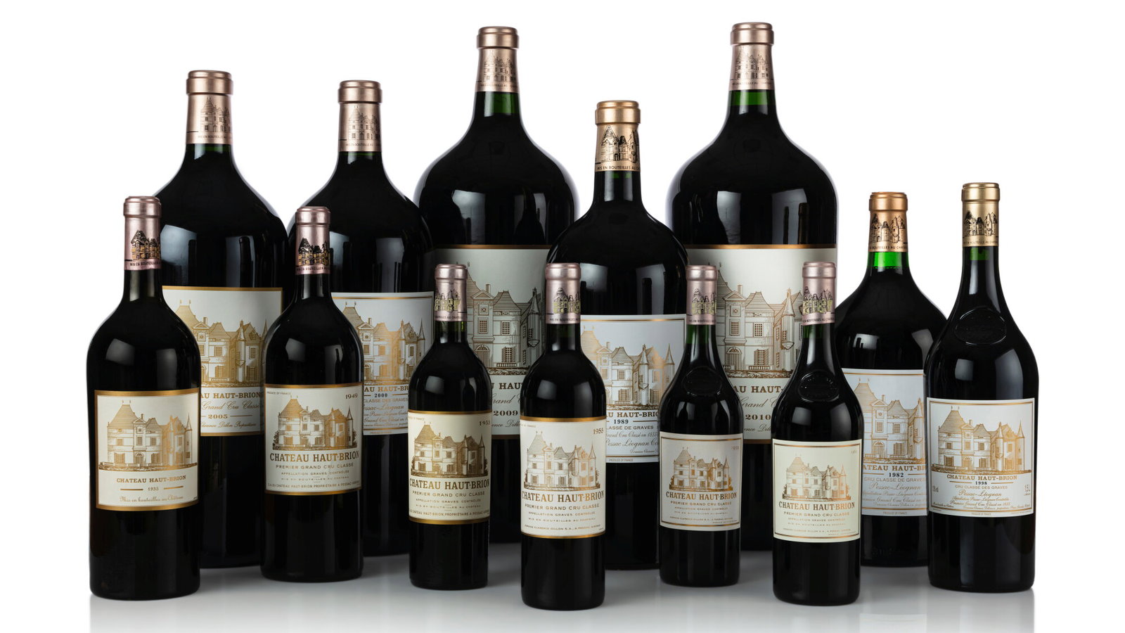 Collection of Château Haut-Brion wine bottles in various formats (standard, magnum, imperial) showing the distinctive château label design; source pag